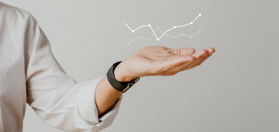Digital graph with businessman hand overlay Digital graph with businessman hand overlay