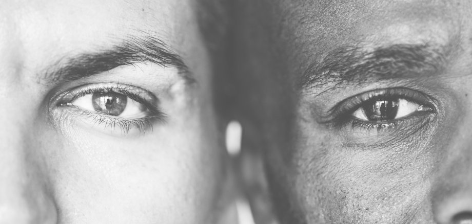 Two different ethnic men&#39;s eyes closeup