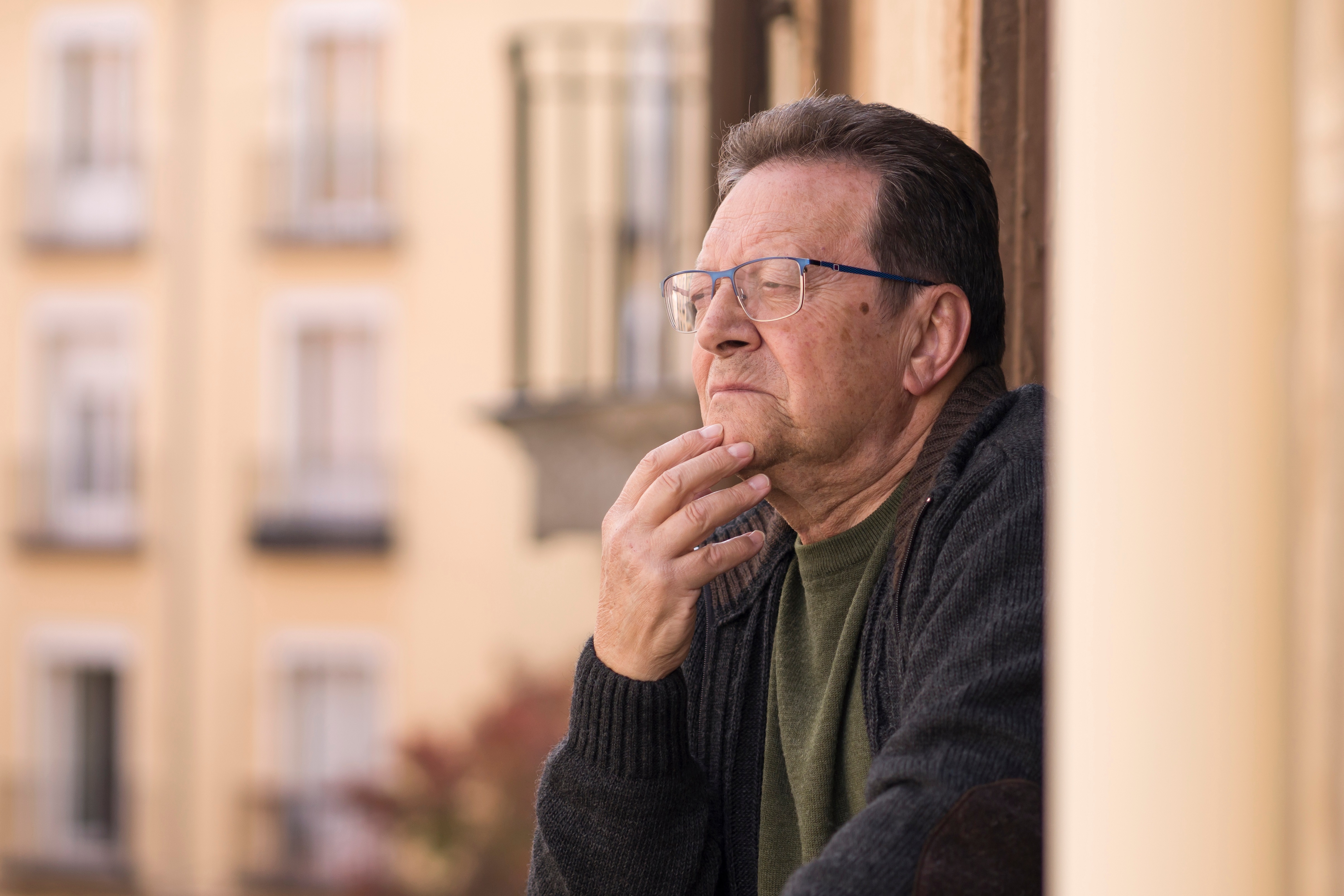 lifestyle portrait of sad and depressed mature man 65 to 70 year