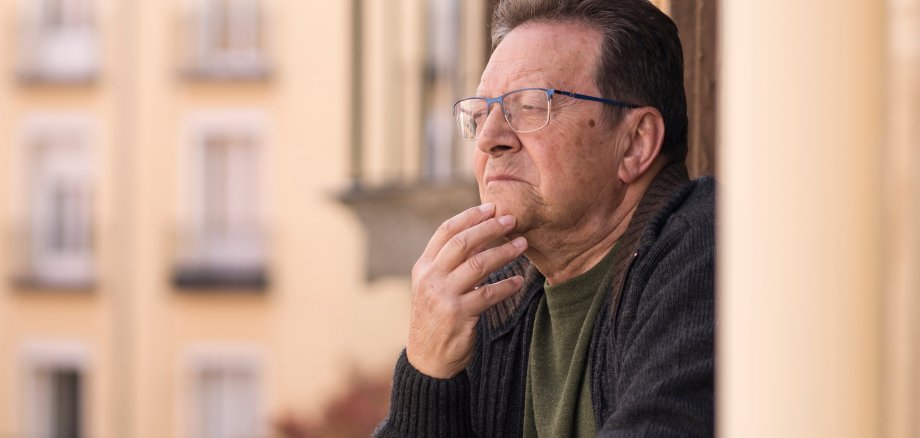lifestyle portrait of sad and depressed mature man 65 to 70 year