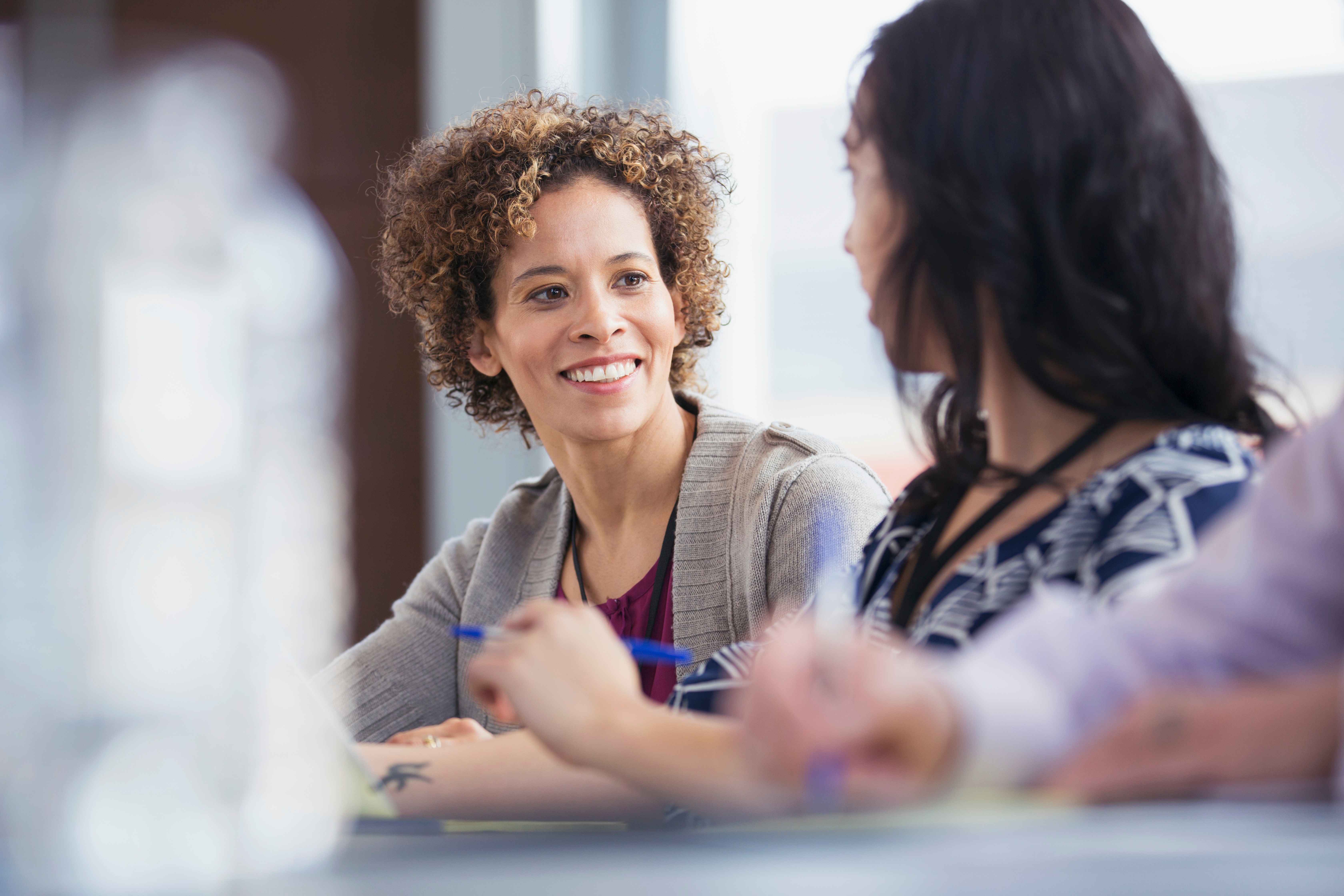 Adult woman having a conversation in classroom.